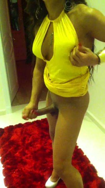 Big cock tranny in yellow dress - ashemaletube.com on ashemalesex.com